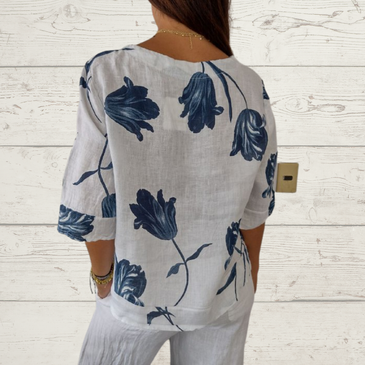 Jeanne | Elegante Blumenbluse – Zentrale Knopfleiste und kurze Ärmel 