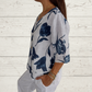 Jeanne | Elegante Blumenbluse – Zentrale Knopfleiste und kurze Ärmel 