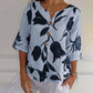 Jeanne | Elegante Blumenbluse – Zentrale Knopfleiste und kurze Ärmel 